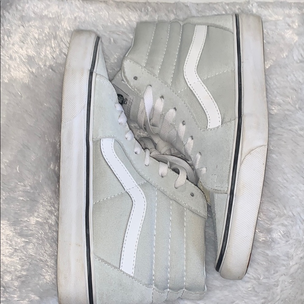 Light blue high top vans. Half suede, half cloth.